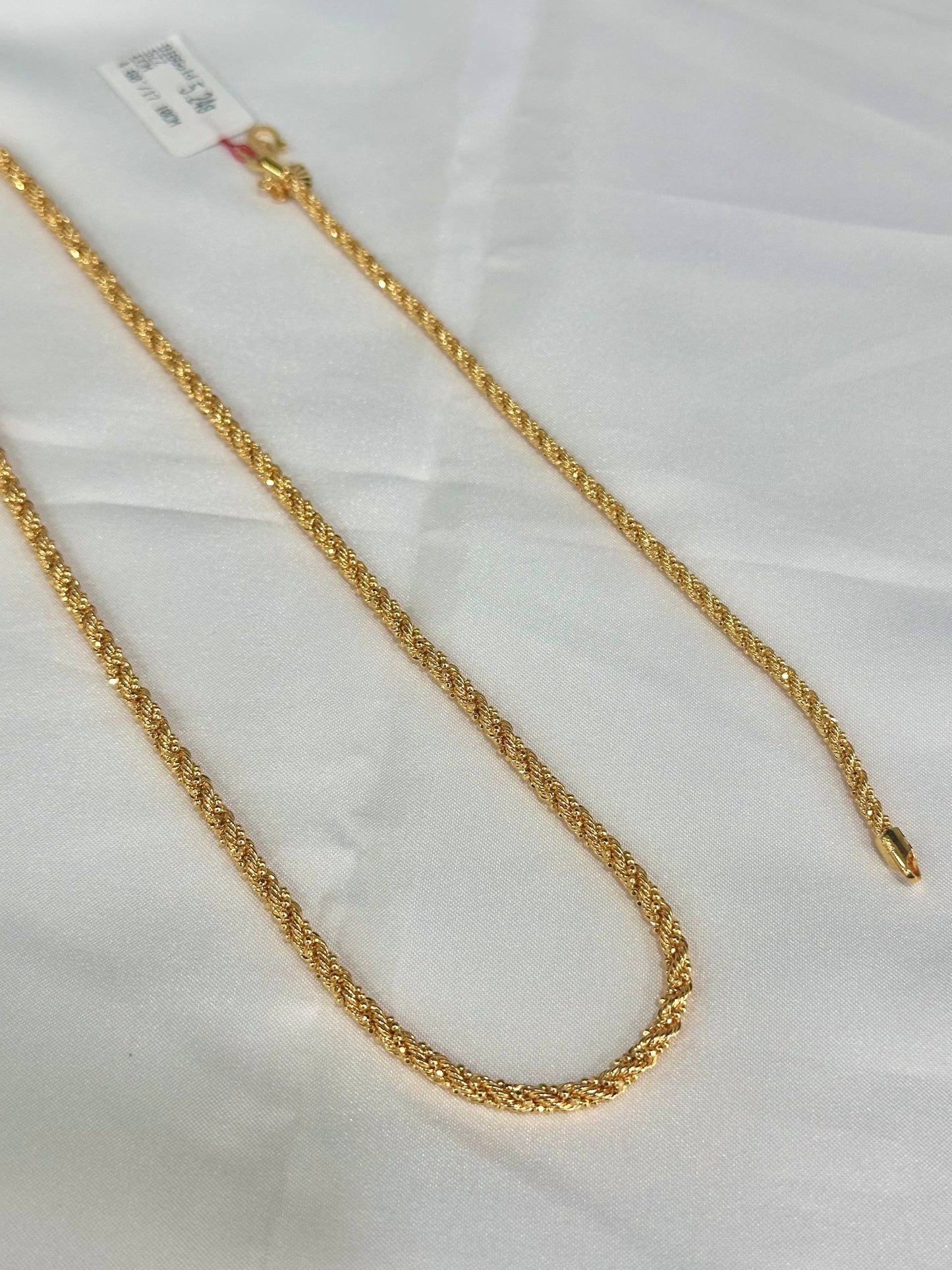 Gold chain on a white background