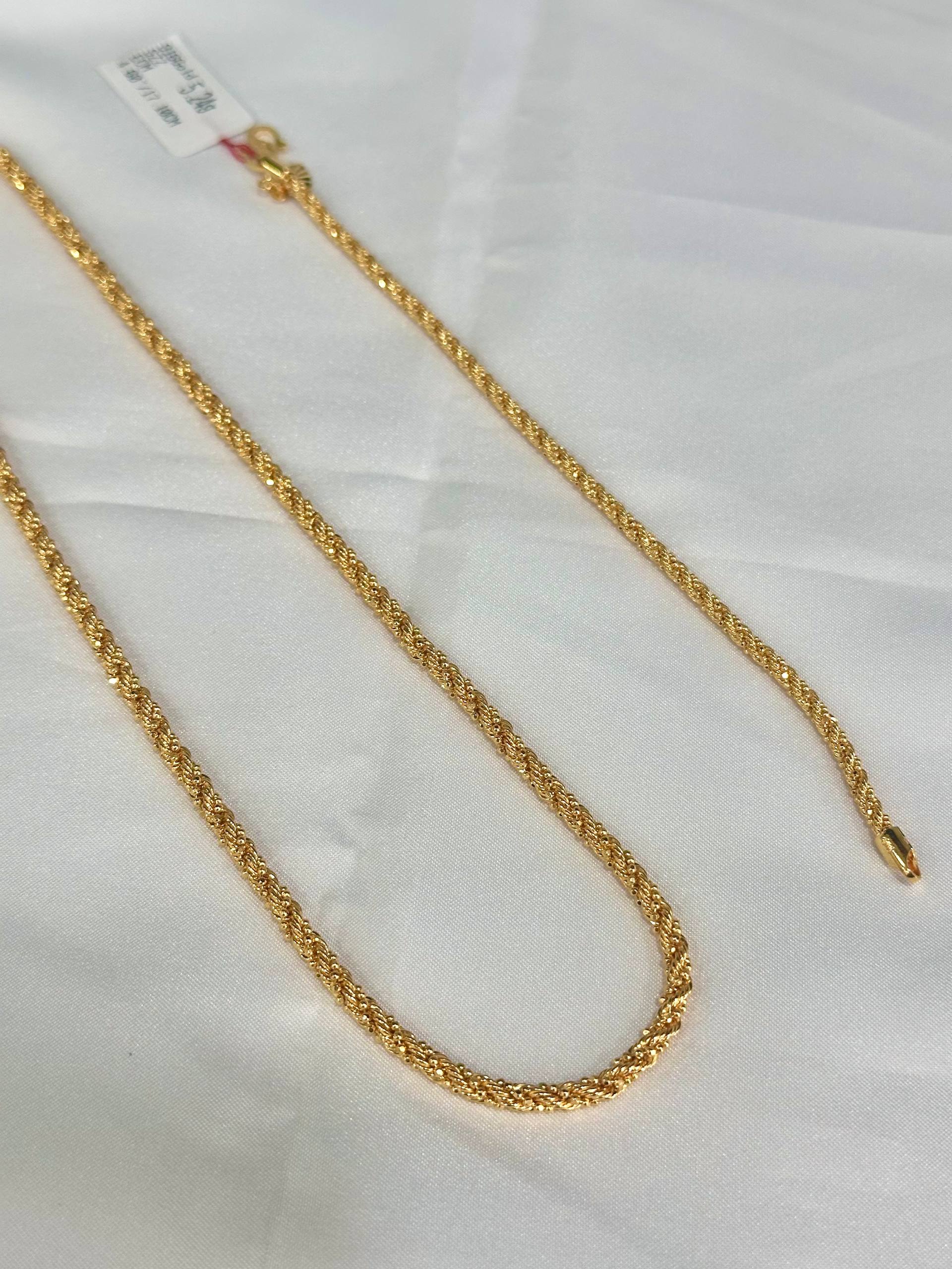 Gold chain on a white background