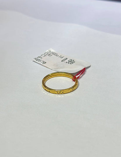 "Gold ring on a white background with a label"