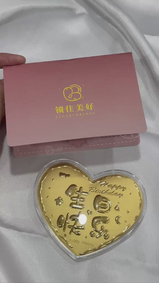 "Love shape 999 gold with a birthday card on white background"