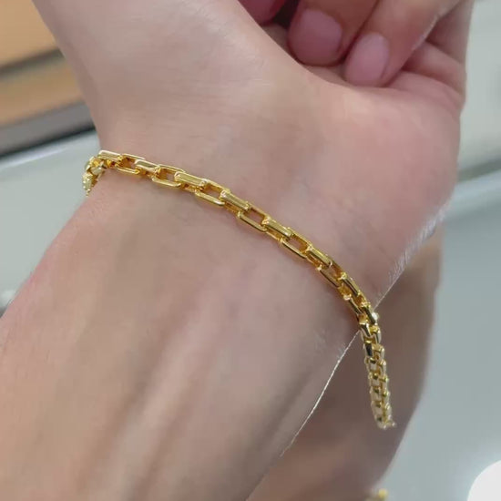 "Elegant solid gold bracelet featuring a contemporary rectangle design, perfect for adding a touch of sophistication to any outfit."