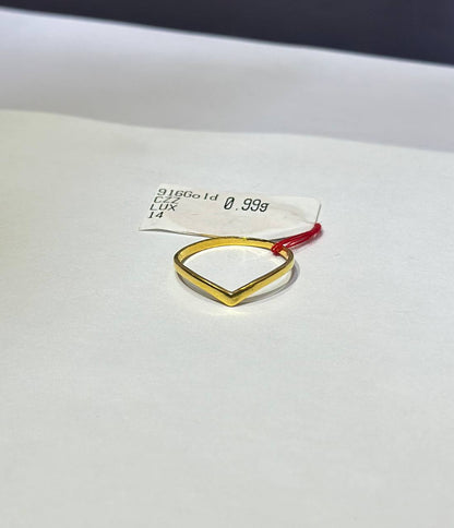 "Gold ring design V with a red accent on a white background"